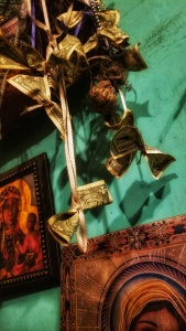 dollar bills, tied with ribbons, hanging from the ceiling.